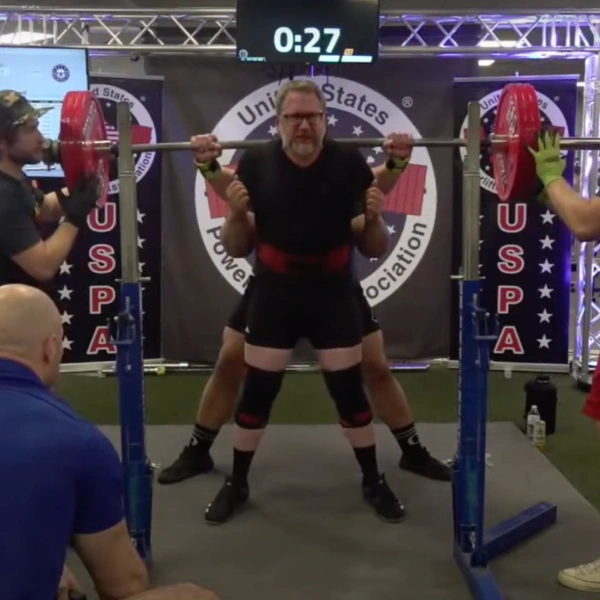 Powerlifter completing a competition squat