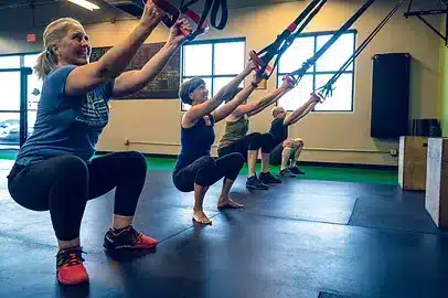 A small group fitness class training with kettlebells in Tucson